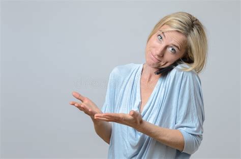 Woman Shrugging Her Shoulders In Ignorance Stock Photo Image 63676926