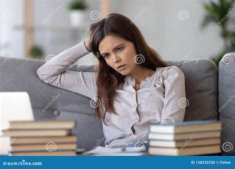 Tired Bored Teen Looking At Books Stressed By Exam Preparation Stock