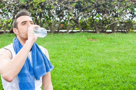 Man Drinking Water After Exercise Pr High Quality Sports Stock Photos