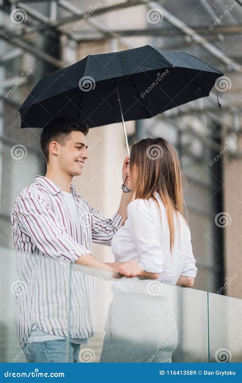 Young Couple Of Lovers Under A Umbrella In City Handsome People Having