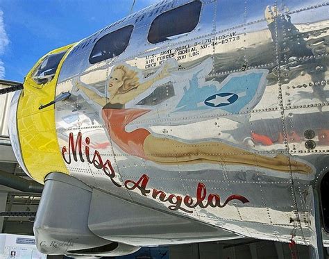 The Nose Of An Airplane Painted With Images Of Women