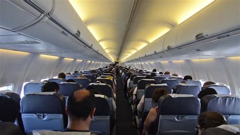 Inside Airplane Passengers Sitting In Aircraft Airborne Flying