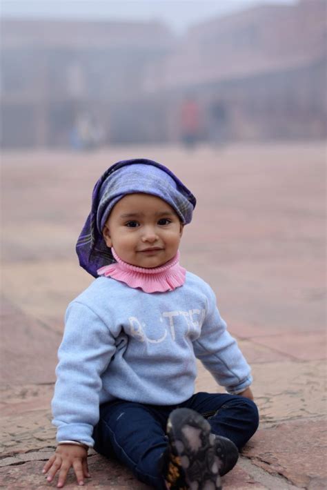 Baby Sitting And Smiling On The Ground Free Image By Amit Dabas On