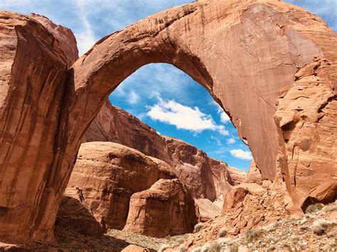 Rainbow Bridge Inside Glen Canyon Utah The Red Rock Contrasting Against The Blue Sky Is
