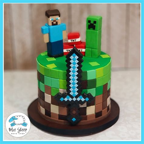 The birthday buffet with minecraft cake, empanadas, cupcakes, chocolates and other goodies for the kids' afternoon party. Minecraft Birthday Cake | Blue Sheep Bake Shop