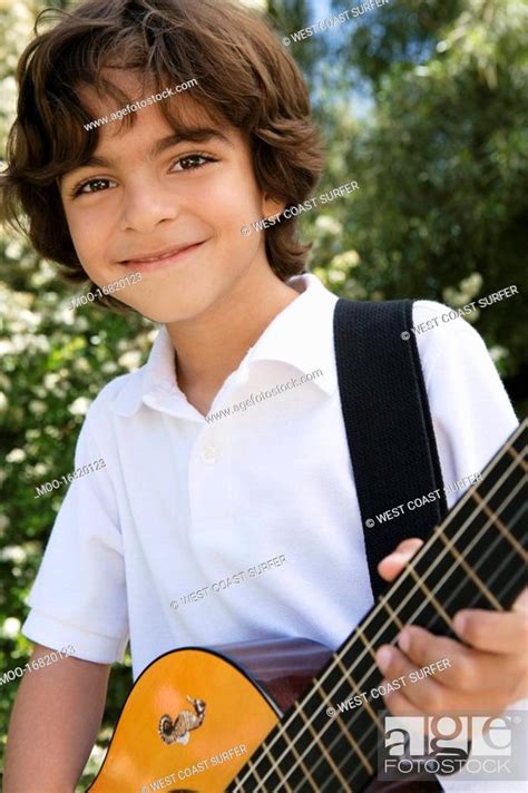 Little Boy Playing Guitar Stock Photo Picture And Royalty Free Image