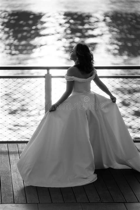 Happy Young Bride Woman In White Dress Running Summer Shooting Near A Water Wedding Rest