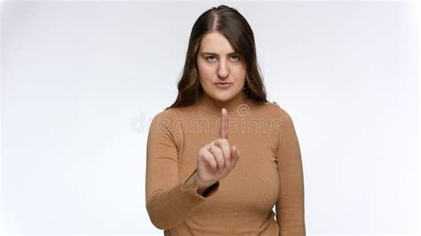 portrait of serious woman shaking finger and saying no concept of ban prohibition and taboo
