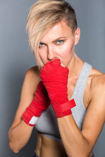 Woman Is Wrapping Hands With Red Boxing Hand Wraps Stock Photo