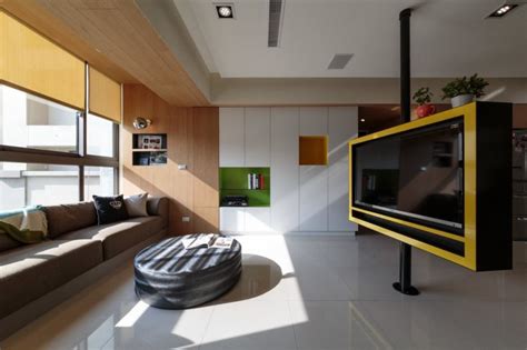 Pivoting Tv Turns Playful Apartment Into Entertainment Area