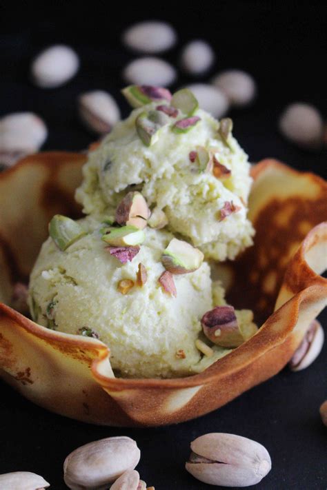 Easy homemade pistachio ice cream made with cream, evaporated milk, eggs, sugar, vanilla and almond extract. Homemade No Churn Pistachio Ice Cream - DomesticAdventurer
