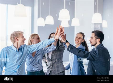 Business Team Giving High Fives Gesture Cheer Success Stock Photo Alamy