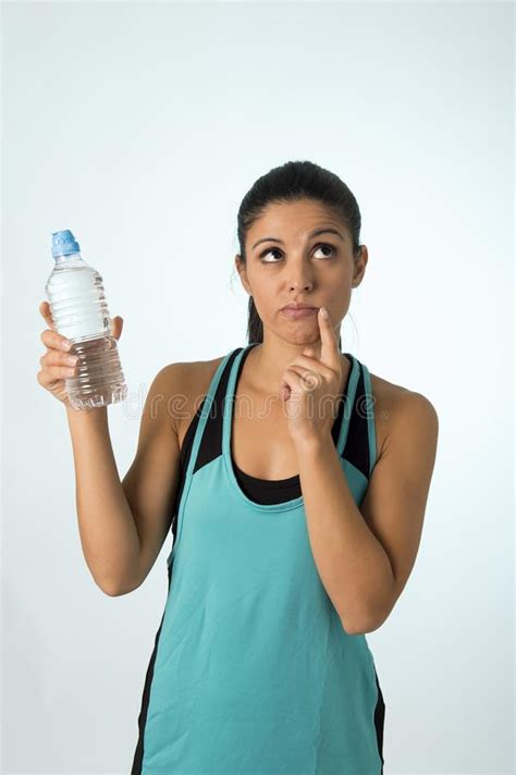 Young Attractive And Beautiful Latin Sport Woman Holding Water Of