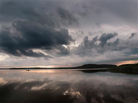 Photo Of Lake Under Cloudy Sky · Free Stock Photo