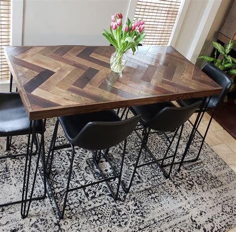 This simple end table is ideal if you want to give an end table an upgrade rather than replace it. Ana White | Herringbone Bar Height Dining Table with Hairpin Legs - DIY Projects
