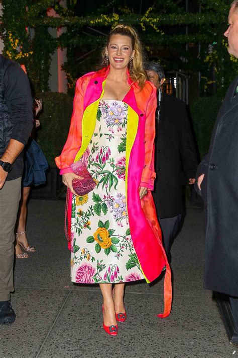 blake lively is giving carrie bradshaw in a floral maxidress and neon manolo blahnik heels