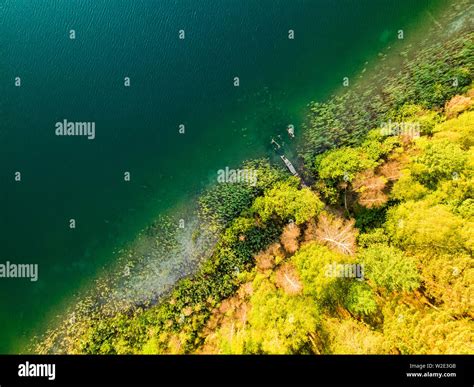 Aerial Top Down View Of Beautiful Green Waters Of Lake Gela Birds Eye
