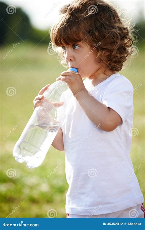 Little Girl Drinking Clean Water From Bottle Stock Photo Image Of