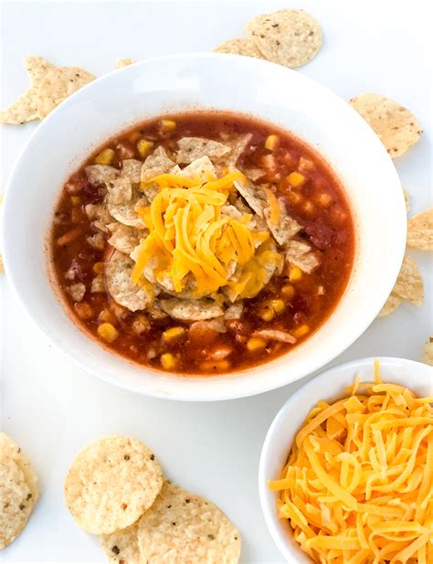 Stir in the chicken, beans and chiles. Chicken Enchilada Soup Recipe - Poppy + Grace