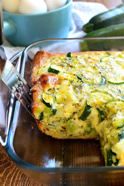 Juicy zucchini slices with spicy feta and aromatic spring onions are hidden in this pretty casserole with the golden crispy top layer. Cheesy Zucchini Bake | Recipe | Zuchinni recipes, Recipes ...