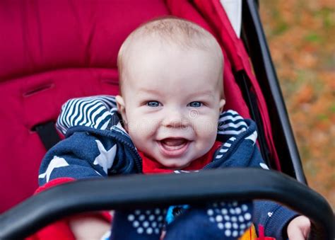 Happy Baby Boy Sitting In A Stroller Stock Photo Image Of Beautiful