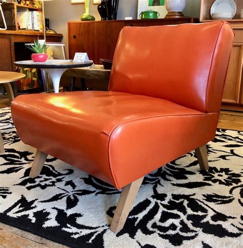 Slipper chairs came about in the 18th century and were mainly in women's dressing rooms. Vintage Orange Vinyl Slipper Chair **SALE** $95 | Circa