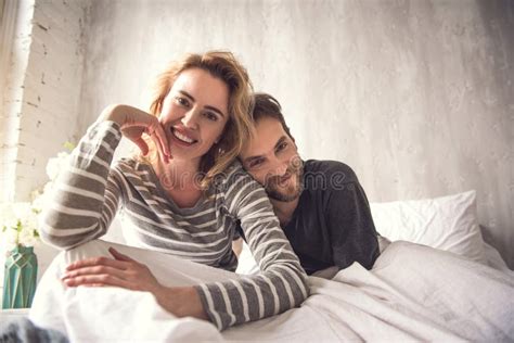loving couple is cuddling in bed stock image image of love bedroom 118194345