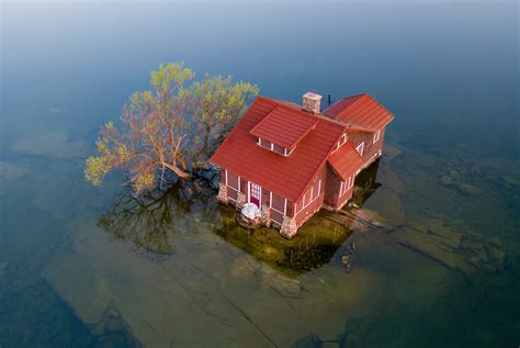 Tiny Island With Red Cottage Duncan Rawlinson
