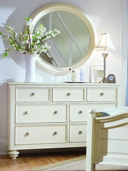 A white dresser with mirror is a great way to add flair to a cottage style bedroom set or a modern one with clean lines. white round mirror over dresser - nursery | For the Home ...