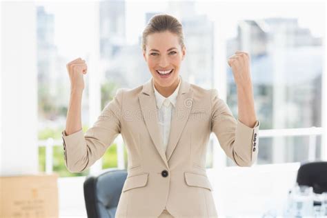 Cheerful Businesswoman Clenching Fists In Office Stock Photo Image Of