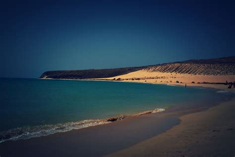 The area surrounding the beach is a spectacular desert landscape. Sotavento Beach-Fuerteventura | Fuerteventura, Beach ...
