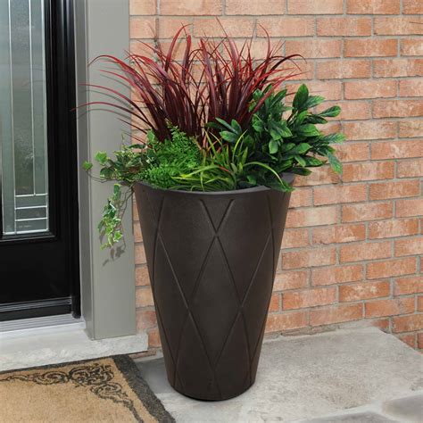 The 'versailles', or orange tree planter is a stunning planter with ball finials and mouldings to give it a truly classic look. Versailles Tall Planter 26" | USA Exterior