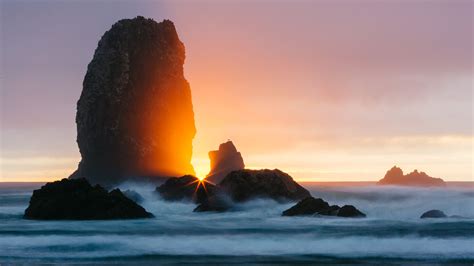 Download Wallpaper 3840x2160 Ocean Rock Sunset Rays Surf 4k Uhd 16