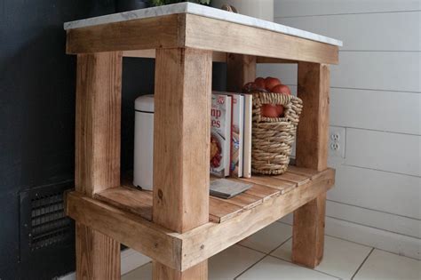 Cabinetry and shelves are often made of wood, which lends itself naturally to the. Kitchen Cart: DIY Rustic Cart with Marble Top - Seeking ...