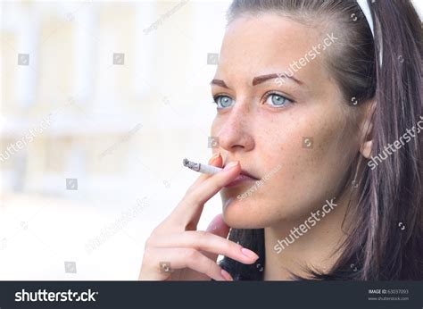 Closeup Of A Pretty Woman Smoking At The Street Stock Photo 63037093