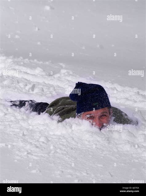 Man Buried In Snow Stock Photo Royalty Free Image 4777193 Alamy