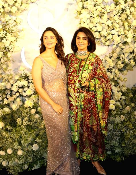 Mumbaibollywood Actresses Alia Bhatt And Neetu Kapoor Pose For Photographs During Wedding