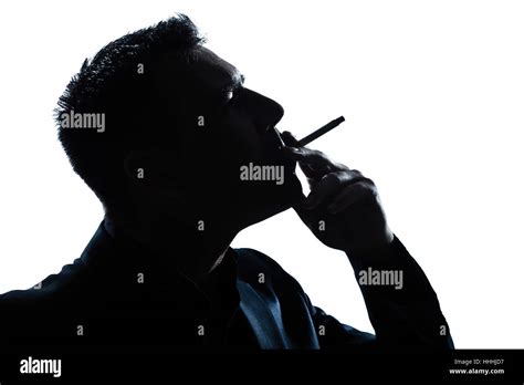 One Caucasian Man Portrait Smoking Cigarette Silhouette In Studio