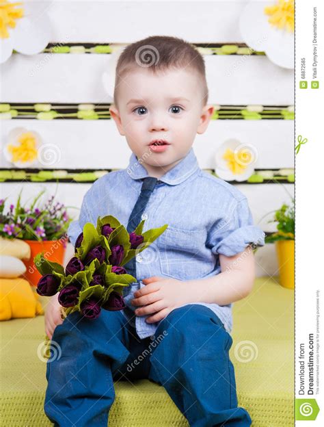 Cute Boy In A Blue Denim Shirt And Tie Jeans And Boots Stock Image