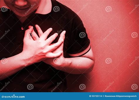 Man With Severe Heartache Suffering From Chest Pain Stock Photo