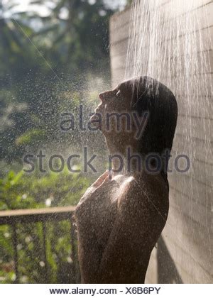Como Shambhala Estate Bali Indonesia Woman In Outdoor Shower Stock