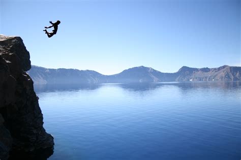 Person Jump Off In A Cliff Photography Hd Wallpaper Wallpaper Flare