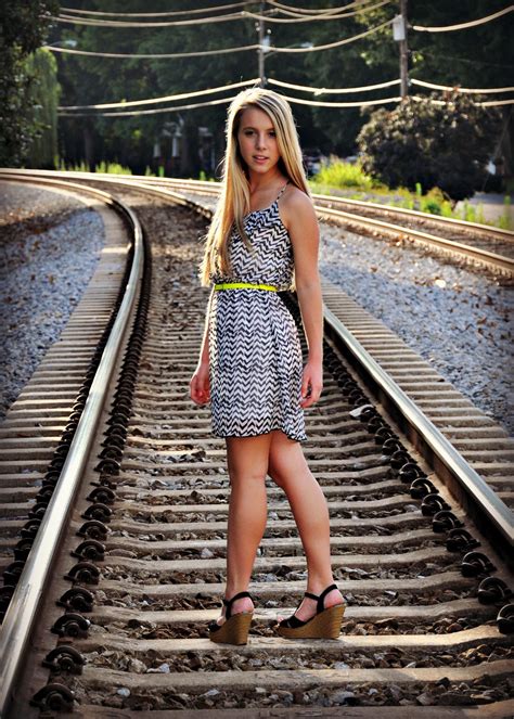 Girl Poses On Train Tracks She Walking Down Tracks And Then Turns And