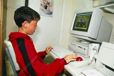Young Boy Playing On A Personal Computer Stock Image T4200284