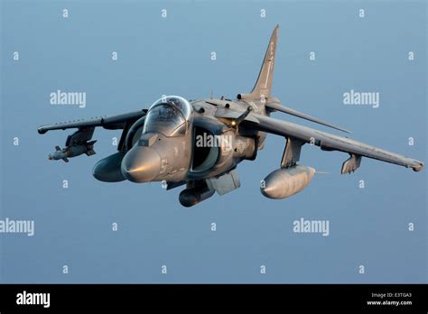 A Us Marine Corps Av 8b Harrier Ii Fighter Aircraft Flies Over The