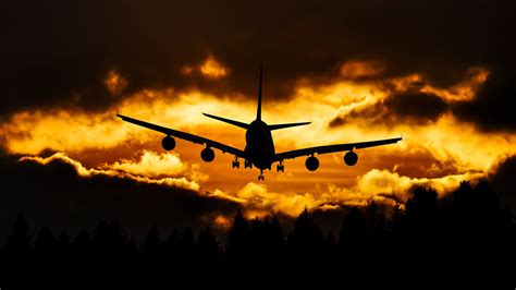 Download Wallpaper 1600x900 Airplane Clouds Sky Sunset Widescreen 16