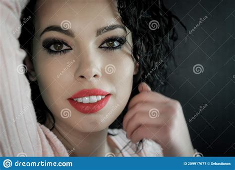Close Up Portrait Of A Beautiful Young Woman With Curly Black Hair And