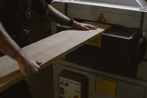 Crop Carpenter Using Thicknessing Machine To Trim Wooden Board · Free