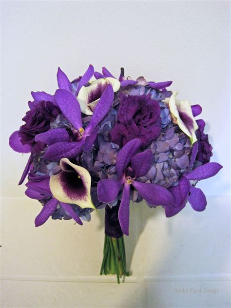 Bouquet with purple calla lilies greenery and white flowers. Purple Wedding Bouquets - Dahlia Floral Design