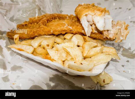 Traditional British Fast Food Takeaway Meal Of Battered Fish And Chips